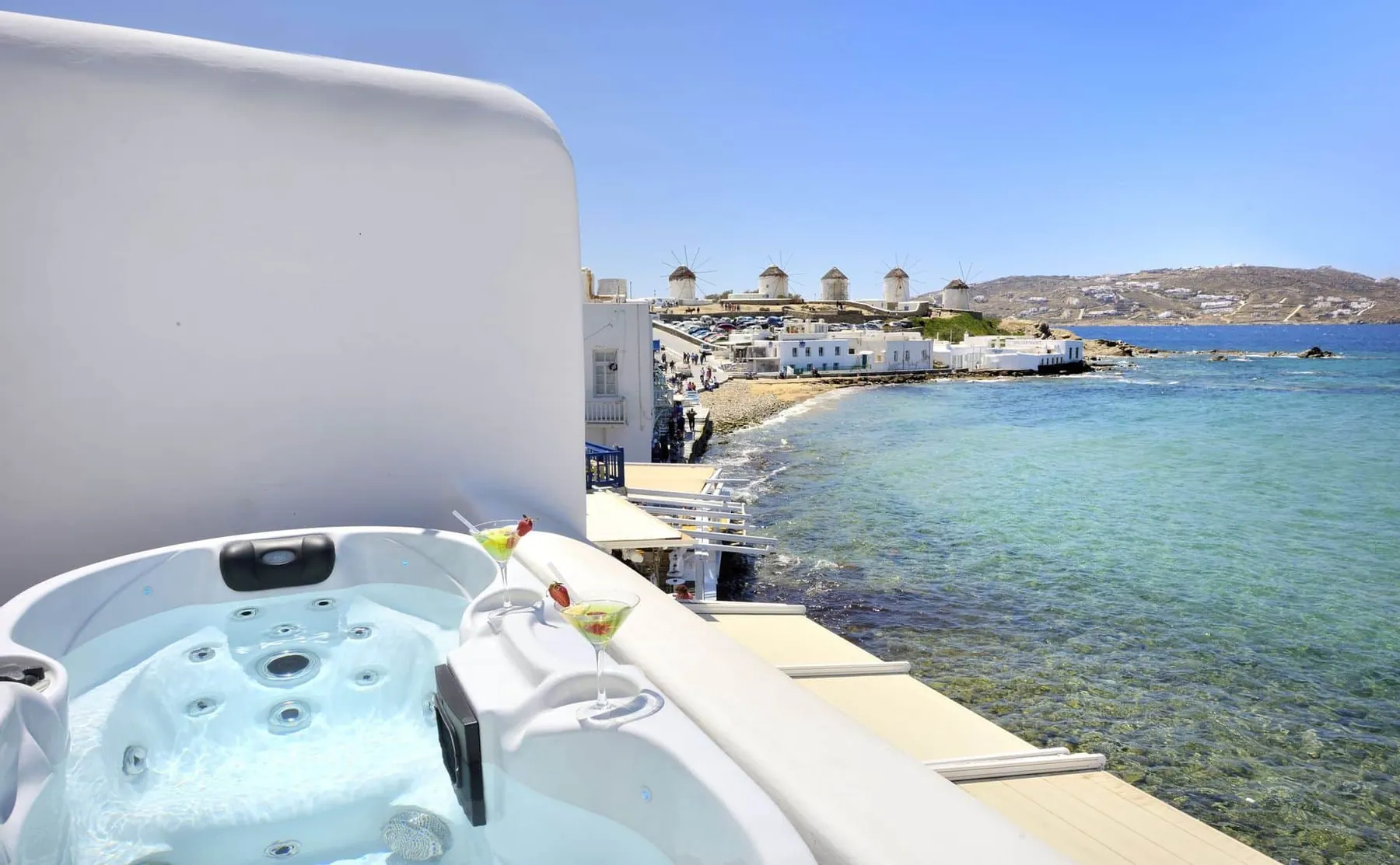 A whitewashed Aegean Collection terrace with a private outdoor jacuzzi above Little Venice, Mykonos